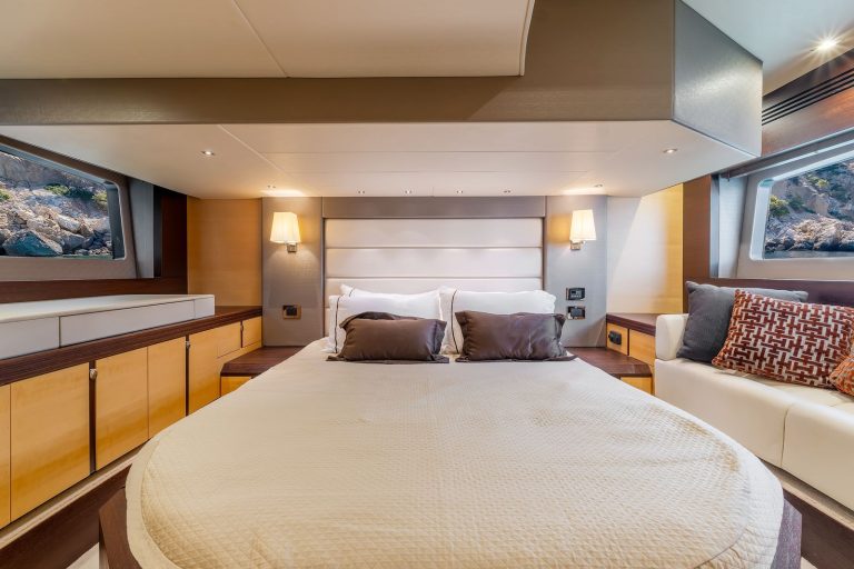 Double bed in the master cabin of a Sunseeker yacht