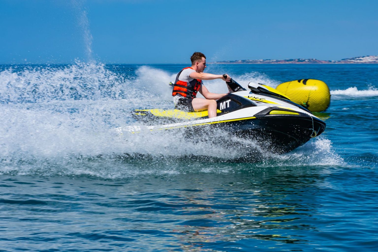 Rider making a high speed turn on a jet ski
