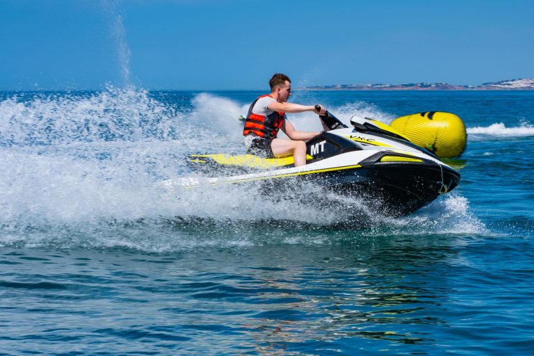 Rider making a high speed turn on a jet ski
