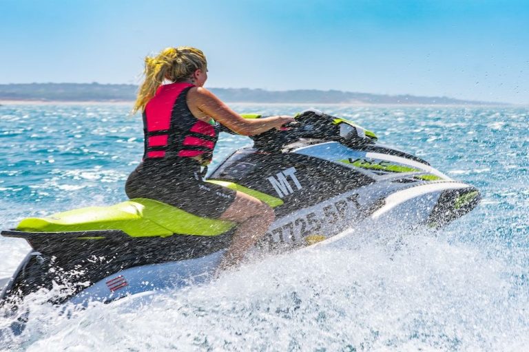 Rider on a jet ski close to the beach on the Algarve coast