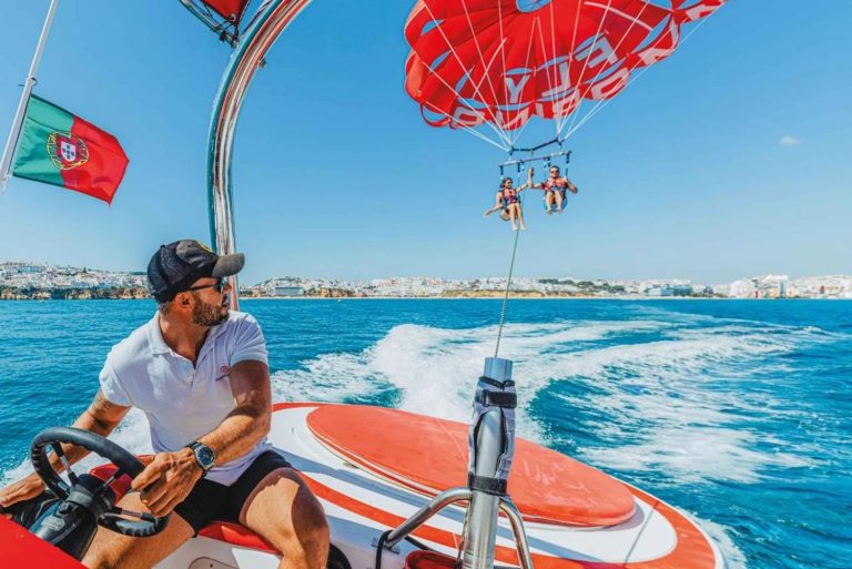 Parasailing boat with skipper towing flyers off Albufeira