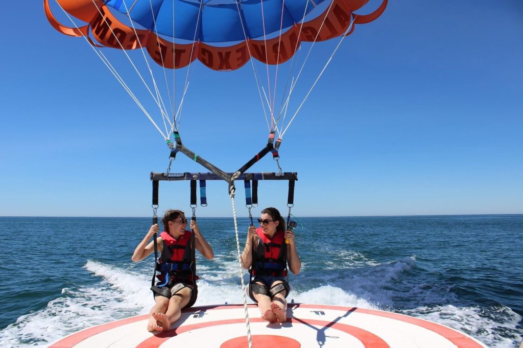 Two people on a tandem parasailing flight