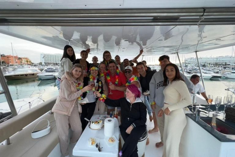 Group of friends celebrating on board a private boat in the Algarve