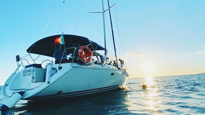 Sailing yacht on the sea at sunset on the Algarve coast